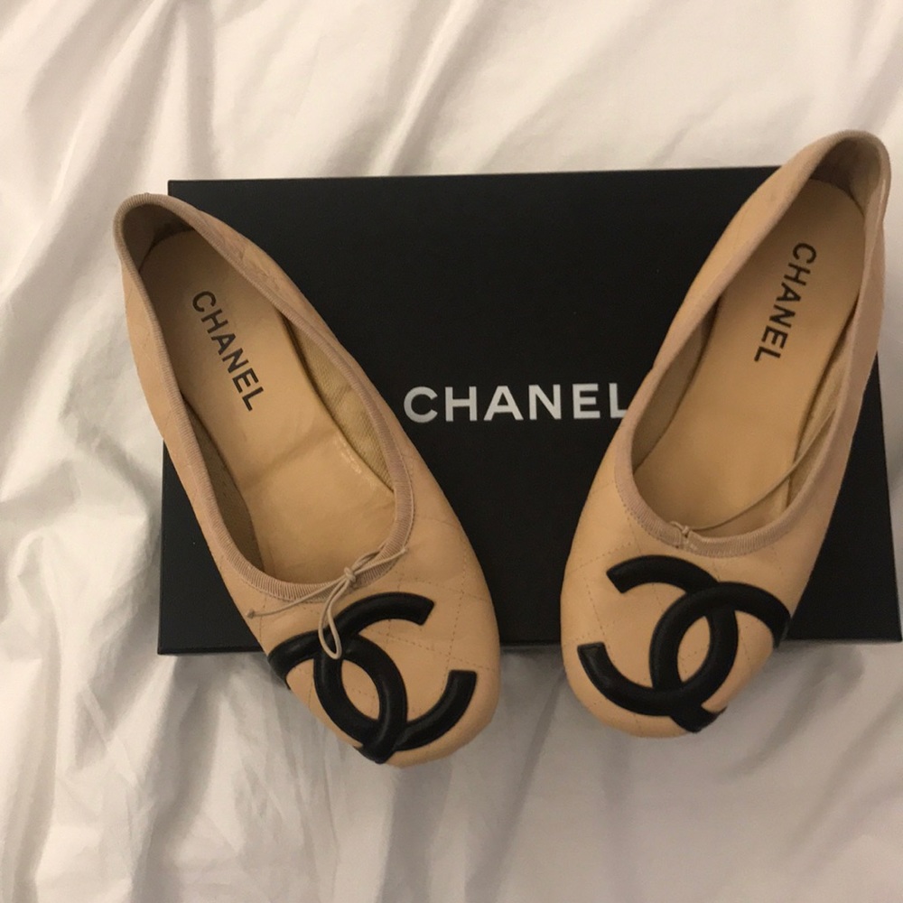 Tan and black Chanel flats